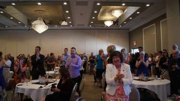 Lambton College President Judith Morris receives three standing ovations during her speech to large crowd gathered for Wednesday's announcement. June 24, 2015 (BlackburnNews.com Photo by Briana Carnegie)