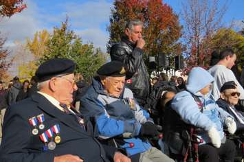 Second World War veteran Michael Sydorko speaks to another veteran at the Remembrance Day ceremony at the Cenotaph in Victoria Park in London, November 11, 2016. (Photo by Miranda Chant, Blackburn News.)