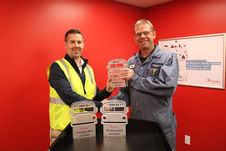 Travis Kelly presenting award to Kevin Graf. Photo provided by Chuck Archer, Voyago Vice President of Marketing and Communications. 