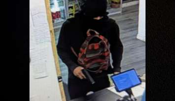 A suspect wanted in an armed robbery in west Windsor is seen in a security camera image on October 1, 2025. Photo provided by Windsor police