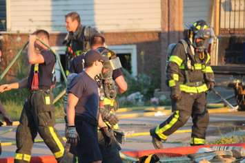 Windsor firefighters on scene of a house blaze, July 9, 2018. Photo by Mark Brown/Blackburn News.