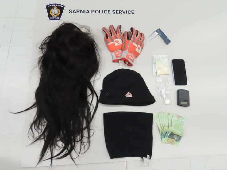 A disguise, drugs and cash seized by Sarnia Police - Mar. 26/26 (Photo courtesy of Sarnia Police Service)