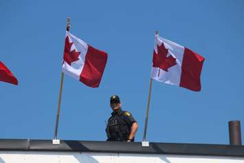 An RCMP officer patrols Canada Day celebrations in Leamington, July 1, 2018. (Photo by Adelle Loiselle)