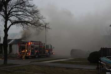 Windsor fire crews battle a blaze at 1574 Gladestone Ave., April 7, 2015. (Photo by Jason Viau)