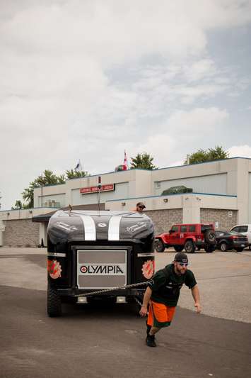 Chris Kurz in early training to raise money for the Listowel hospital.  He will pull the Olympia through the 2015 Paddyfest Parade in Listowel on Saturday.  (Photo courtesy of Nicole Kaufman, Kaufman Klicks Photography)