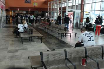 Detroit Tigers baseball fans wait to board the Transit Windsor Tunnel Bus on Opening Day 2015, April 6, 2015. (Photo by Mike Vlasveld)