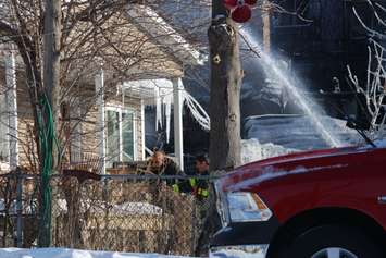 Firefighters at the scene of two house fires in the 800-block of Assumption St. in Windsor March 2, 2015. (Photo by Adelle Loiselle.)