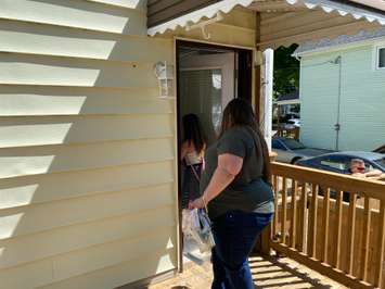 Kelly Edwards and her daughter Piper in front of their new Habitat for Humanity home on Bright Street in Sarnia. June 26, 2020 Photo by Melanie Irwin