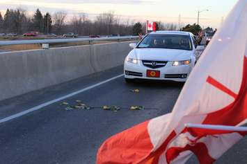Supporters come out to the Communications Rd. overpass on Hwy. 401 for the repatriation ceremony of fallen veteran and Wheatley native John Gallagher on November 20, 2015. (Photo by Ricardo Veneza)