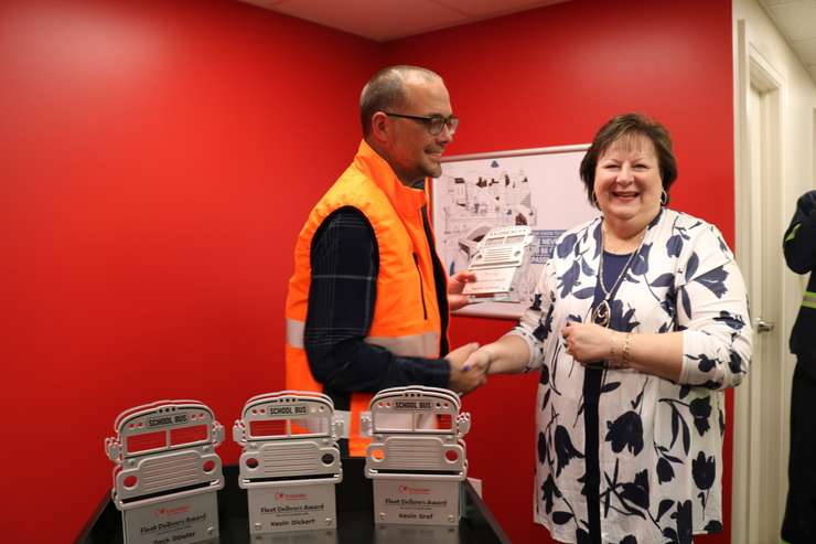 Olivier Tardif presenting award to Bonnie Huffman. Photo provided by Chuck Archer, Voyago Vice President of Marketing and Communications. 
