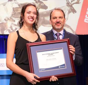 LCCVI student Lexi Graham accepting a 2019 OSSTF/FEESO Student Achievement Award from President Harvey Bischof. March 2019. (Photo by Ontario Secondary School Teachers’ Federation)