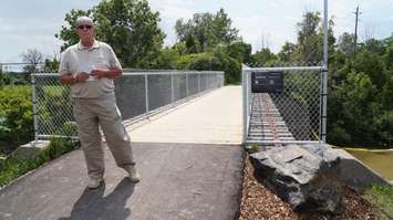 Ward Yorke speaks highly at his brother Ron's memorial dedication ceremony for the Ron Yorke Bridge on the Howard Watson Nature Trail. June 29, 2015 (BlackburnNews.com Photo by Briana Carnegie)