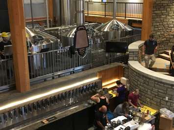 The copper bell that hangs above the bar, right in front of the brewing station, from the catwalk in the dining hall of Cowbell. August 3rd, 2017 (Photo by Ryan Drury)