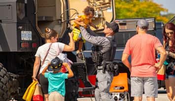 First responders interacting with kids (Image courtesy of Chatham-Kent Crime Stoppers)
