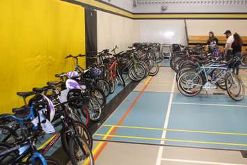 Dozens of refurbished bicycles are lined up in the gym at Begley Public School in Windsor, June 21, 2019. Photo by Mark Brown/Blackburn News.