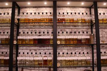 A wall of whiskey at different stages, found at the JP Wisers brand centre on Riverside Dr. in Windsor, March 22, 2017. (Photo by Mike Vlasveld)