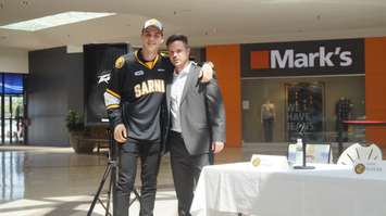 Adam Ruzicka with Sarnia Sting GM Nick Sinclair. (photo by Jake Jeffrey blackburnnews.com)