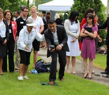Windsor Mayor Eddie Francis tries his hand at lawn bowl at the kickoff to the 2014 Ontario 55+ Summer Games countdown. (Photo by Maureen Revait) 
