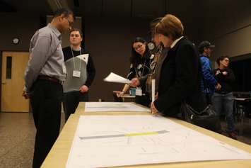 Officials from the Ontario Ministry of Transportation talk to residents about a bridge from the Herb Gray Parkway to what will be the Gordie Howe International Bridge Plaza, December 15, 2015. (Photo by Mike Vlasveld) 