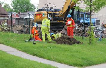 Union Gas employees work to fix a gas pipe, struck in the 1500-block of Ouellette Ave. in Windsor, May 15, 2015. (Photo by Mike Vlasveld)