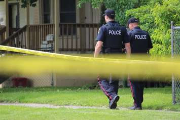 Police investigate an apparent homicide in the 500 block of Brant St., June 4, 2015. (Photo by Jason Viau)