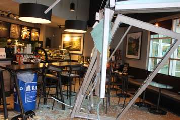 Officials deal with the fallout after a car smashed through a coffee shop on Dougall Ave. in Windsor on March 30, 2016. (Photo by Ricardo Veneza)