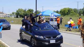 Lambton College 2021 graduates take part in a drive-by parade at the Sarnia school.  16 June 2021.  (BlackburnNews.com file photo)