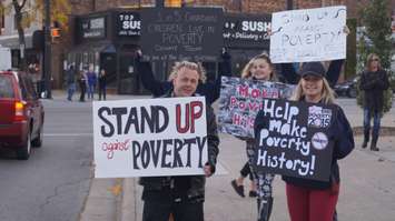 Nearly 100 people supported a rally on Sarnia City Hall steps Friday to help end poverty. October 16 2015 (BlackburnNews.com Photo by Briana Carnegie)