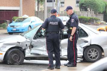 A car and a Transit Windsor bus collide at the intersection of Erie and Goyeau, August 10, 2015. (Photo by Jason Viau)