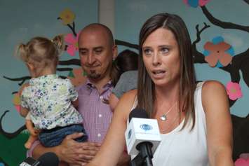Stephanie Seguin, her husband Matt and their two daughters Hazel and Nola speak at the launch of a newly redesigned program at the John McGivney Children's Centre in Windsor, August 20, 2015. (Photo by Mike Vlasveld)