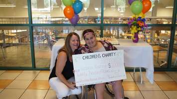 Mother, Tanya and daughter, Victoria Keating at Sarnia's Real Canadian Superstore after being awarded a $20,000 grant for a wheelchair accessible vehicle.  August 14, 2015 (BlackburnNews.com Photo by Briana Carnegie)