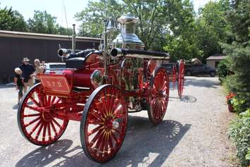 Stan Uher of Blenheim (middle) has restored a 1897 fire steam engine from Dawson City, Yukon.  July 17, 2017.  (Photo by Paul Pedro)