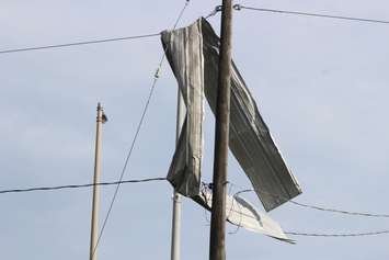 Crews assess and clean up the damage left near the EC Row Expressway and Central Avenue in Windsor on August 25, 2016 after a tornado hit the area. (Photo by Ricardo Veneza)