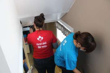 Habitat for Humanity volunteers work to fix up the Matthew House refugee Welcome Centre, December 12, 2017. (Photo by Maureen Revait) 