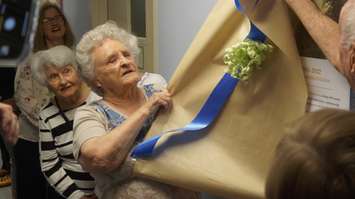 Former Charlotte's Task Force Chair Rosanne Orcutt reveals a plaque in their honour at Petrolia's Charlotte Eleanor Englehart Hospital [CEEH]. May 31, 2023 Photo by Melanie Irwin.