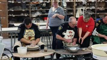 Local politicians, police and other community members work on pottery at Lambton College. January 12, 2015 (BlackburnNews.com photo by Jake Jeffrey)