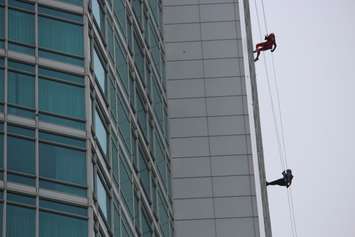 People rappel down the side of Caesars Windsor to raise money for local Easter Seals families through the charity's Drop Zone event, October 6, 2015. (Photo by Mike Vlasveld)
