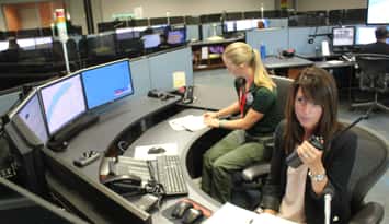 Officials with 911 dispatch in Windsor test new cross-border communication equipment, August 12, 2015. (Photo by Jason Viau)
