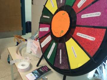 Grade 11 and 12 students at Ursuline College in Chatham set up a booth with games and prizes focused on sharing information on the dangers of tanning on June 2, 2016. (Photo by Ricardo Veneza)