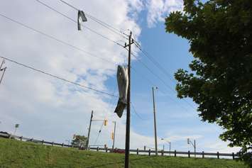 Crews assess and clean up the damage left near the EC Row Expressway and Central Avenue in Windsor on August 25, 2016 after a tornado hit the area. (Photo by Ricardo Veneza)