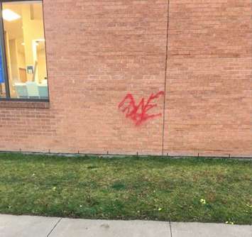 Graffiti on the side of a bank in Bothwell. (Photo courtesy of Chatham-Kent police)