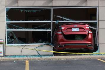 Emergency crews respond to a walk-in clinic on Tecumseh Rd. E after a car smashes through the front window, June 8, 2015. (Photo by Jason Viau)