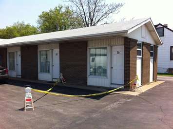 A dead body was found by staff inside this motel room in the 2200 block of Huron Church Rd., May 8, 2015. (Photo by Mike Vlasveld)