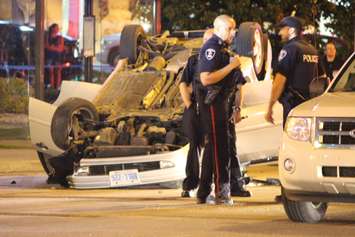 One vehicle flipped following a collision at the intersection of Howard Ave. and Tecumseh Rd. E, May 19, 2015. (Photo by Jason Viau)