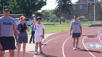 Nathan Oliphant prepares for his leg of the Sarnia Pan Am torch run June 16, 2015 (BlackburnNews.com Photo by Briana Carnegie)