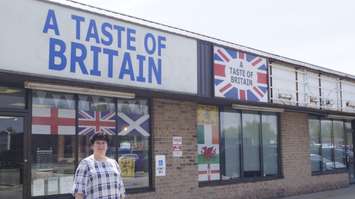 Manager Karen Tobin stands outside A Taste Of Britain on the eve of the Royal Wedding. May 18, 2018. (Photo by Colin Gowdy, BlackburnNews)