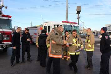 Firefighters at Richmond and Queen St., getting ready to go door-to-door as part of their reassurance campaign. November 22, 2016. (Photo by Natalia Vega)