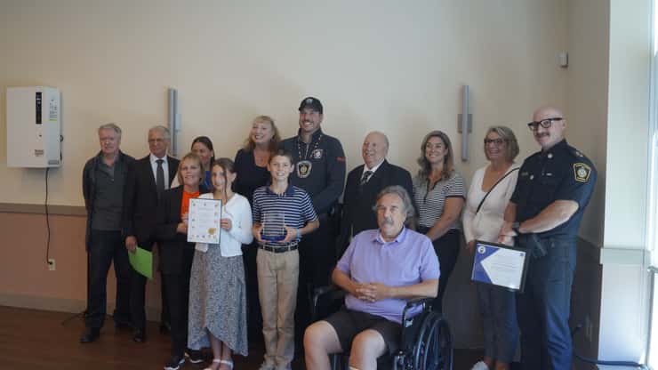 Cst. Tyler Callander with his family and local dignitaries. September 28, 2026. (Photo by Natalia Vega)