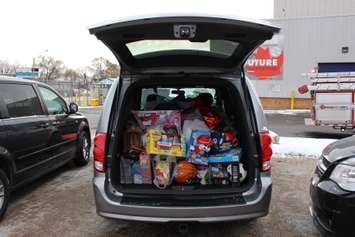 Windsor firefighters collect toys from Chrysler, being donated to Sparky's Toy Drive, November 20, 2014. (photo by Mike Vlasveld)