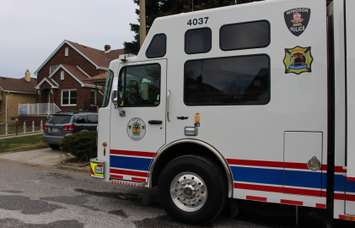 Windsor police and fire control centre parked just outside of a duplex where a 31-year-old woman's body has been discovered, December 11, 2014. (photo by Mike Vlasveld)